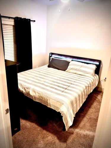 a bedroom with a bed with a black frame at New! 1 Bed 1 Bath Medical Center NRG Area Middle of Everywhere in Houston