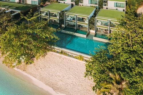 an aerial view of a house with a swimming pool at My Beach Resort Phuket, Panwa Beach in Panwa Beach