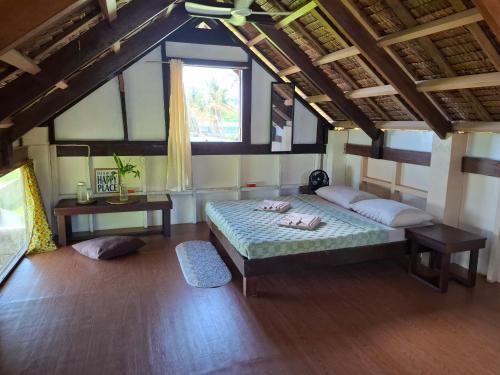 a bedroom with a bed in a room with a window at BlueWave Surf Stay in San Isidro