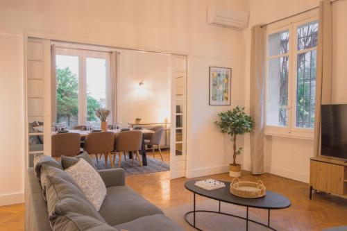 a living room with a couch and a table at Maison Vauban in Marseille