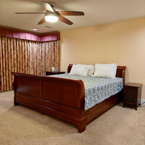 a bedroom with a bed with a ceiling fan at Star Lake Shores in Kent