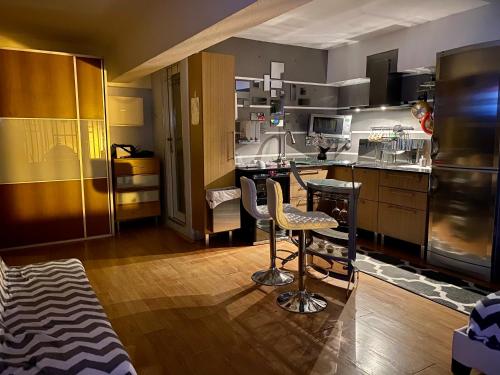 a kitchen with a table and some chairs in it at iDesign Loft at Old San Juan in San Juan