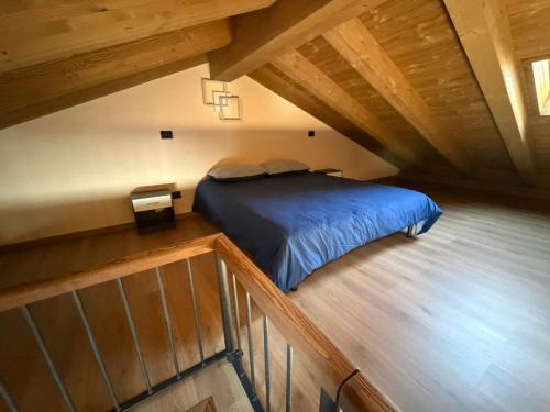 a bedroom with a bed in a attic at Coudrey 2 in Doues