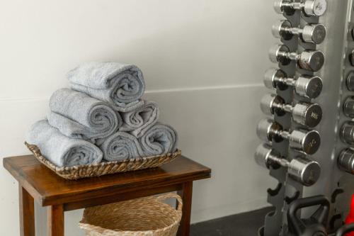 a basket of towels sitting on top of a table at Dazzler by Wyndham Buenos Aires Recoleta in Buenos Aires