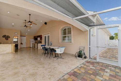an open living room with a table and chairs at 3br,3ba home near Downtown and Airport, Walk to the Stadium in Tampa
