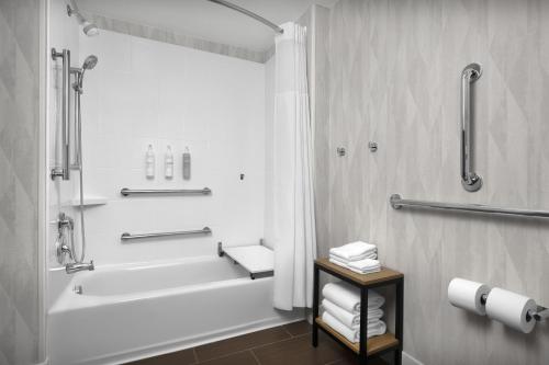 a white bathroom with a tub and a shower at Hampton Inn & Suites Greenville/Spartanburg I-85 in Duncan