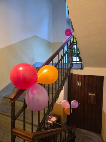 a staircase with balloons attached to a stair case at ROOMS CA' TUNIN- ideale per il Trenino Rosso- a pochi minuti a piedi dalla stazione in Tirano