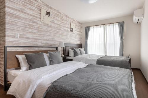 Llit o llits en una habitació de Villa Taito