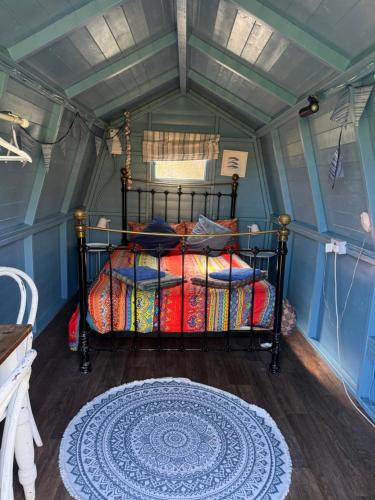 a bedroom with a bed in a room at Penhallow House in Newlyn East