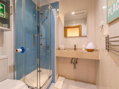 a bathroom with a shower and a sink at Apartment in Oeiras Near Beach Easy Access Lisbon Cascais in Oeiras