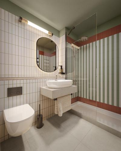 a bathroom with a toilet and a sink and a mirror at Campanile Hotel & Restaurant Gouda in Gouda
