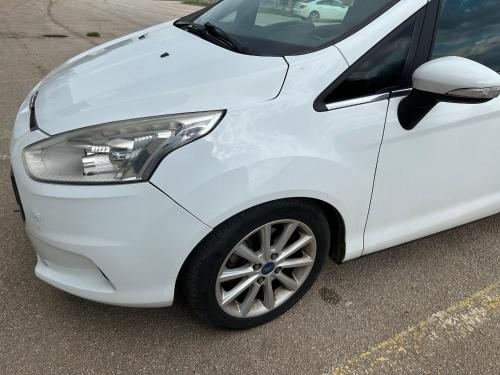 a white car parked in a parking lot at Rent a Car Cipo in Kumanovo