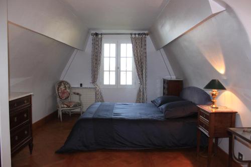 a bedroom with a large bed in a attic at La Bonne Auberge - Seine Panorama SAS in Vieux-Port