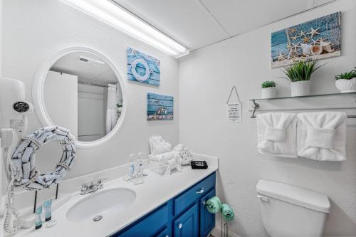 a bathroom with a sink and a mirror at Beach View Condo in Myrtle Beach