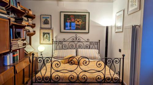 a bedroom with a bed and a book shelf at The Rooster House A Study in Green in Someraro