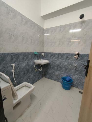 a bathroom with a sink and a toilet and a sink at Hotel The Skyluxe in Agra
