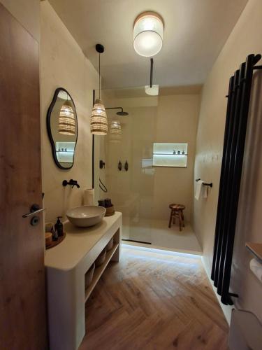 a bathroom with a sink and a shower at Old Town Living Studio in Český Krumlov