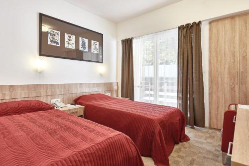 מיטה או מיטות בחדר ב-Kompleks Negorski Banji