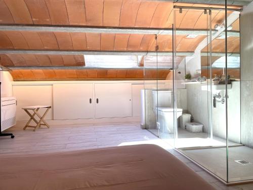 a large room with a glass wall in a kitchen at POAL-Dúplex de ensueño en Cadaqués in Cadaqués