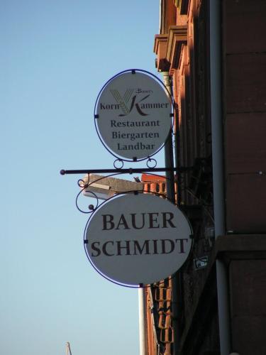a sign for a barber shop on the side of a building at Bauer Schmidt Weilerbach Bauer`s Budget-Hotel in Weilerbach