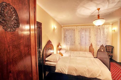 Ένα ή περισσότερα κρεβάτια σε δωμάτιο στο Hotel Evmolpia
