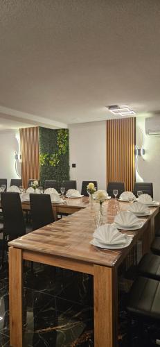 a large wooden table in a room with chairs at Elis in Hrašćina