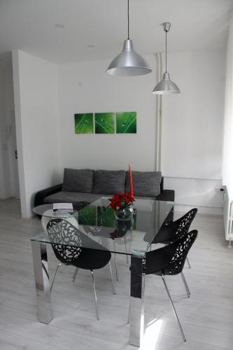 a dining room with a glass table and chairs at Ka Star in Karlovac
