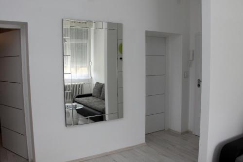 a mirror on a wall in a living room at Ka Star in Karlovac