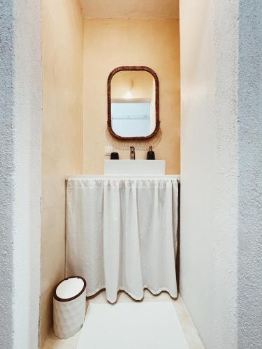 a bathroom with a sink and a mirror at Sand & Sea II in Neo Klima