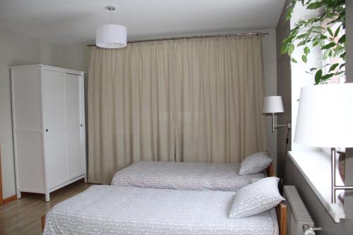 Кровать или кровати в номере Hanna's residence