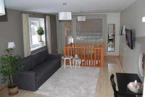 a living room with a couch and a table at Hanna's residence in Valmiera