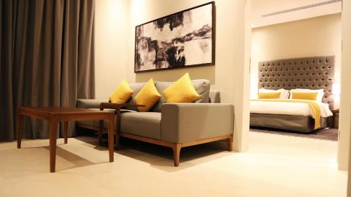 a living room with a couch and a bed at Rafa - Al Nuzhah in Riyadh