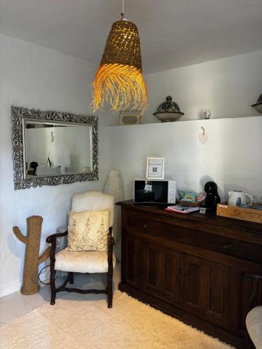 a room with a desk with a chair and a mirror at Ibizan Style Studio in Jesús in Nuestra Señora de Jesus