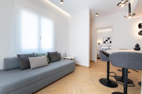a living room with a couch and a table at Memoa Residence Preveza in Preveza