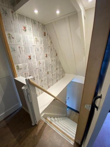 an open door to a small refrigerator in a room at B & Buitenlust in Schagerbrug