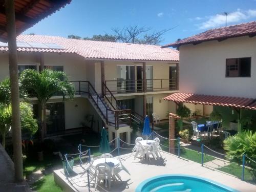 Vista de la piscina de Pousada Paraíso das Palmeiras o d'una piscina que hi ha a prop