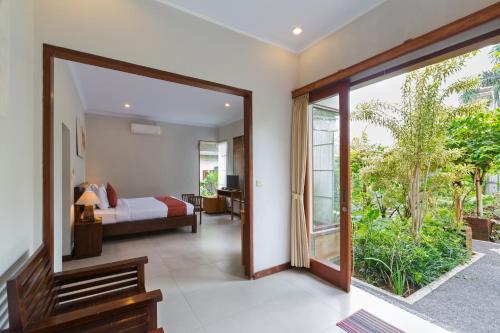 Postel nebo postele na pokoji v ubytování Abipraya Ubud