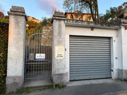 a garage door with a gate and a fence at Garden Seaview Camogli in Camogli