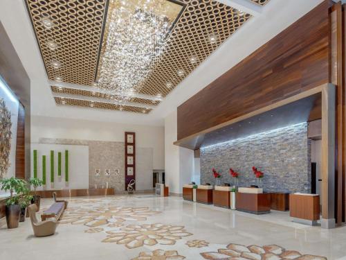 a lobby of a hotel with a large lobby at Swissôtel Living Al Ghurair Centre Dubai in Dubai