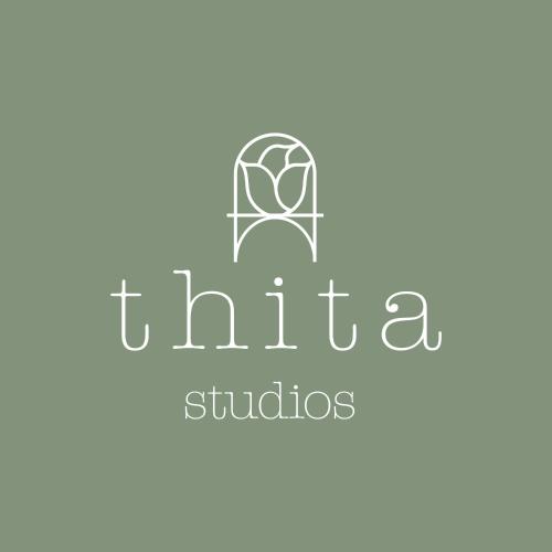 a logo for the school of arts and sciences at Thita Studios ex Anastasiadis House in Neos Marmaras