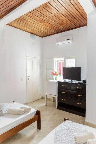 Una cama o camas en una habitación de Vila Marilyn