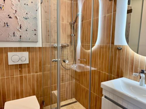 a bathroom with a shower and a sink at Boje in Westerland