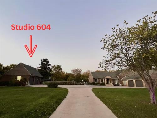 a house with a driveway in front of a house at Set on peaceful 5 acres, 5 min from town, Private Building, Level 2 EV Charger in Bloomington