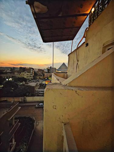 a view of a sunset from a balcony of a building at GRAND MuseuM HoteL in Cairo