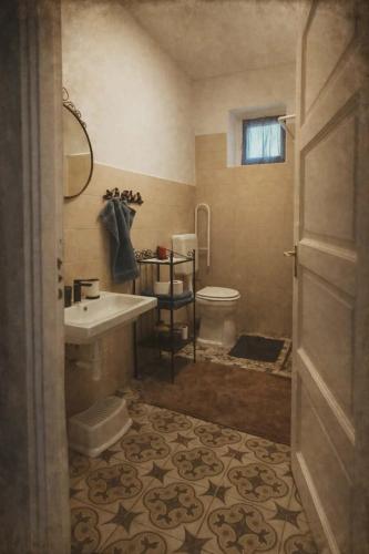 a bathroom with a sink and a toilet at Kékfestő Vendégház in Bükkszentkereszt