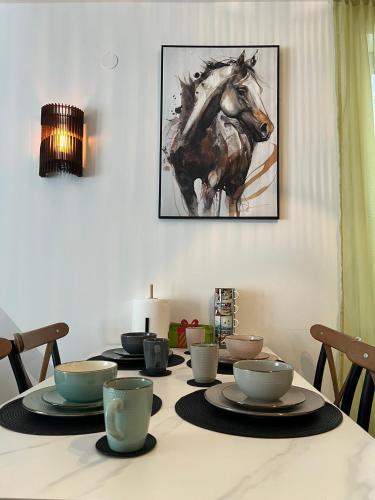 a dining room table with a painting of a horse at Valena 1 - Divčibare Free private Parking in Divčibare