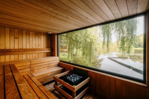an inside view of a sauna with a large window at Crafted at Powdermills in Battle