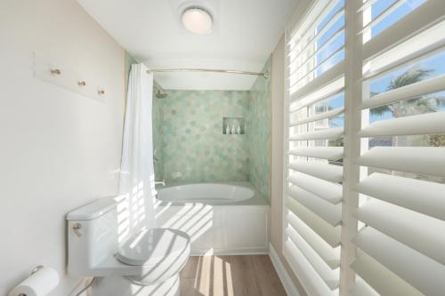 a bathroom with a sink and a window at Villas at Hawks Cay Resort in Duck Key