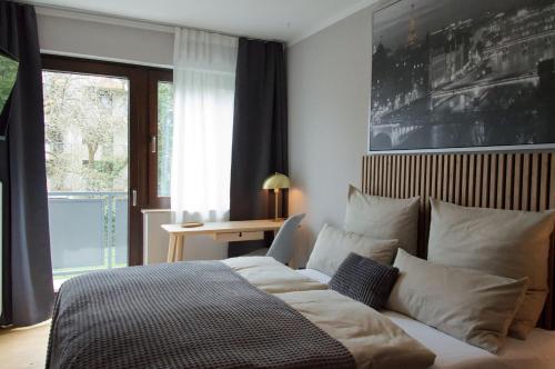 a bedroom with a bed and a window at Wohnen bei FrauSchmitt in Bad König