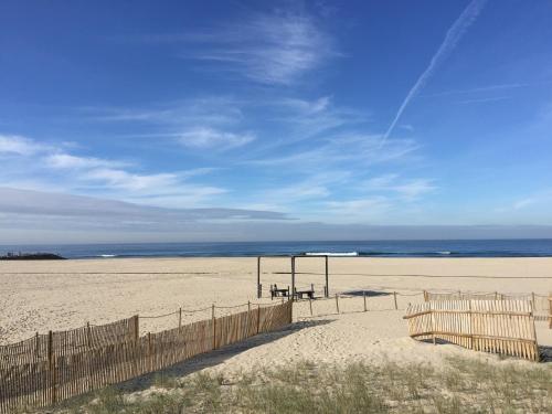 a beach with a volleyball net on the sand at Casa Lagoa Verde in Esmoriz